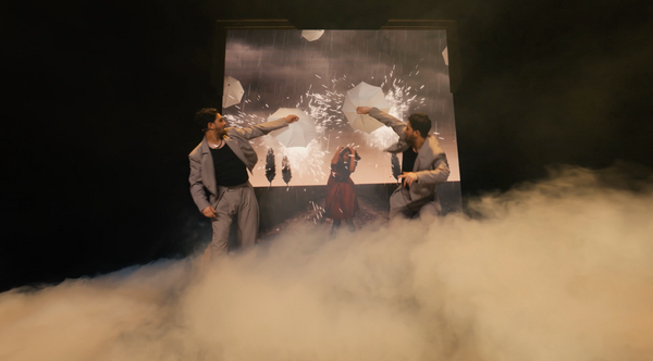 The French Twins on stage with technical LED effects and stage smoke.