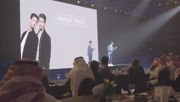 The French Twins displayed on a large screen during a private VIP event in Riyadh.