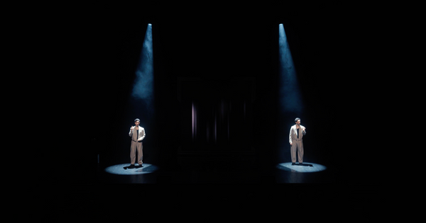 Theatrical spotlight on an empty stage, evoking the origins of AI illusion